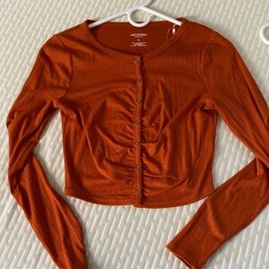 Orange cropped long sleeve